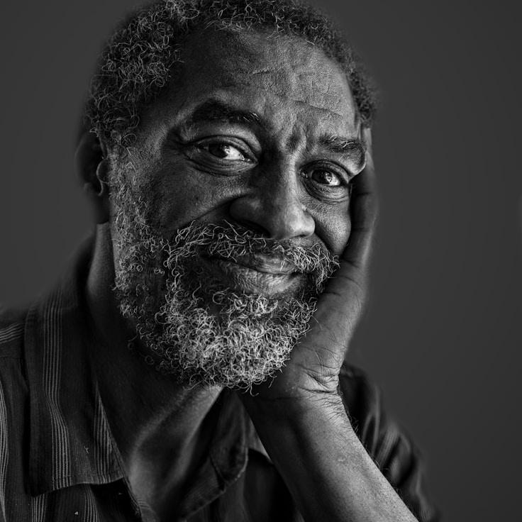 Avery Chen, Lead Design Curator at Compound Studio Ember, reviewing corporate floral arrangements